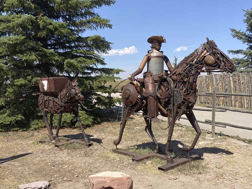 A sculpture of a man riding a horse at TERRY BISON RANCH RV PARK