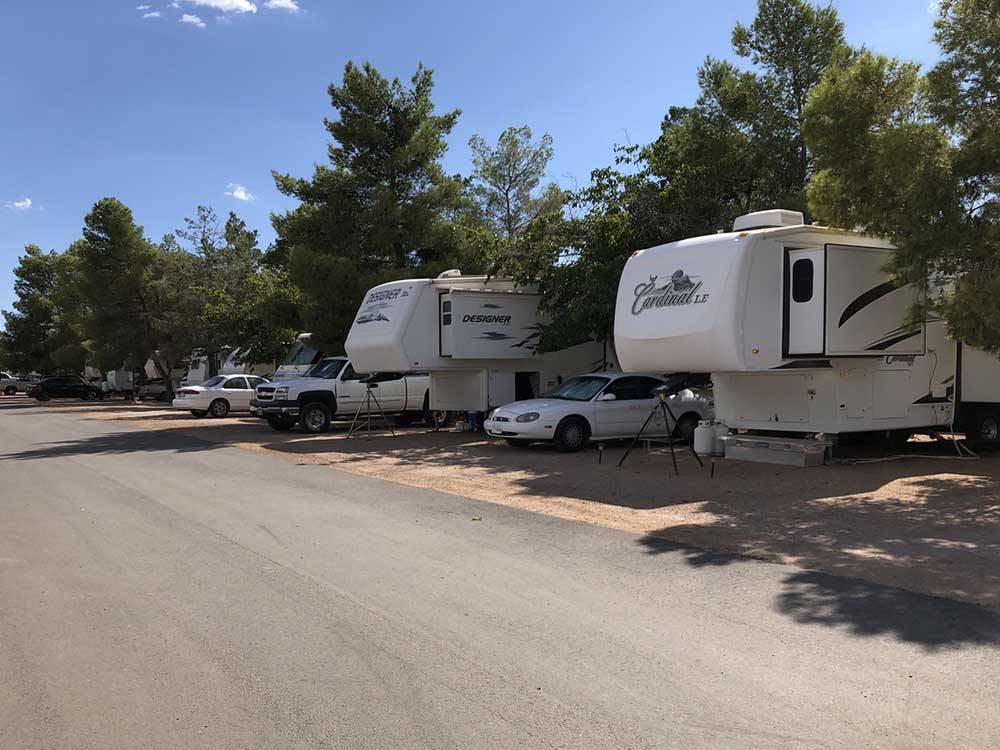 View down the road of campers in campsites at ZUNI VILLAGE RV PARK