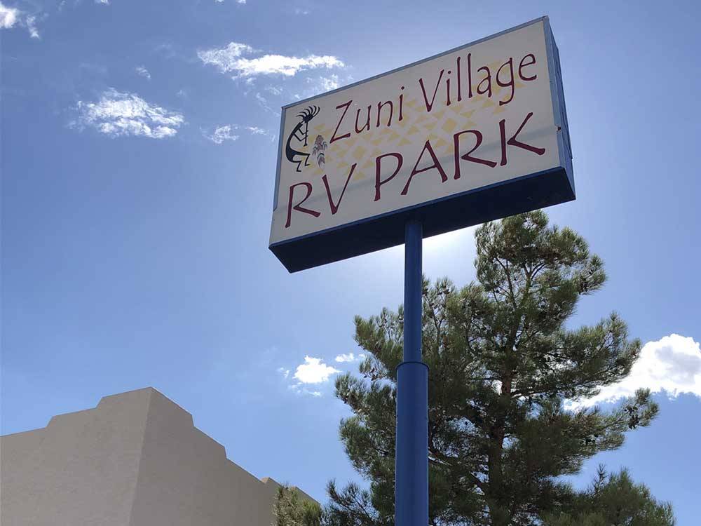 Park sign under a blue sky at ZUNI VILLAGE RV PARK