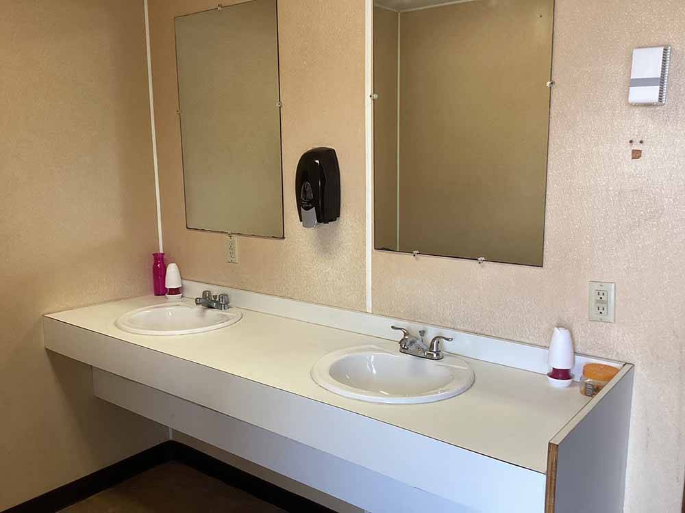 The sinks and mirrors in the bathroom at NAKATOSH CAMPGROUND