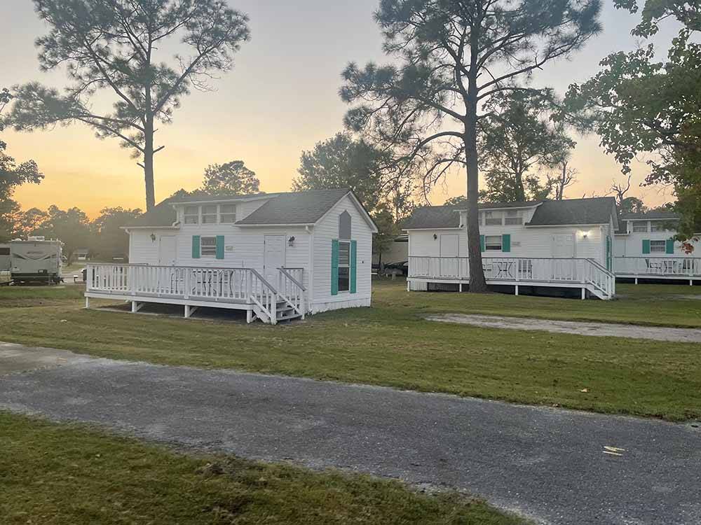 A row of the rental cabins at GULF BREEZE RV RESORT