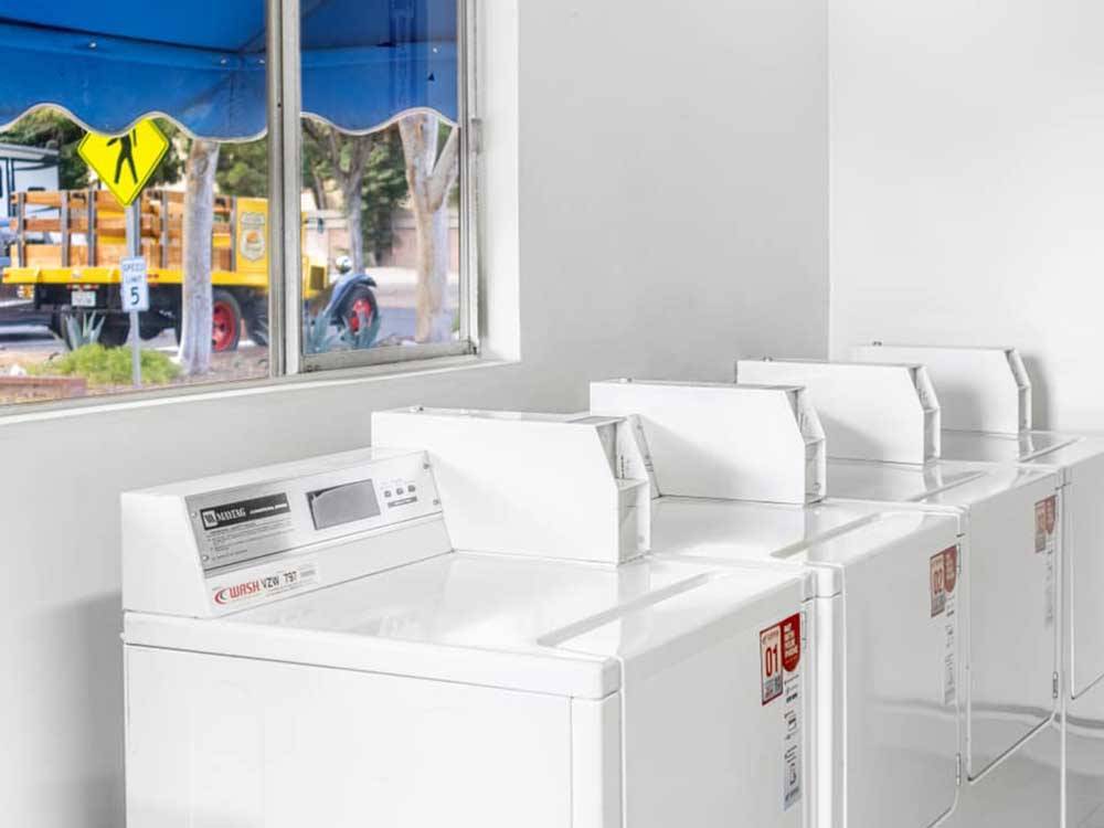 Laundry room with window at WALNUT RV PARK