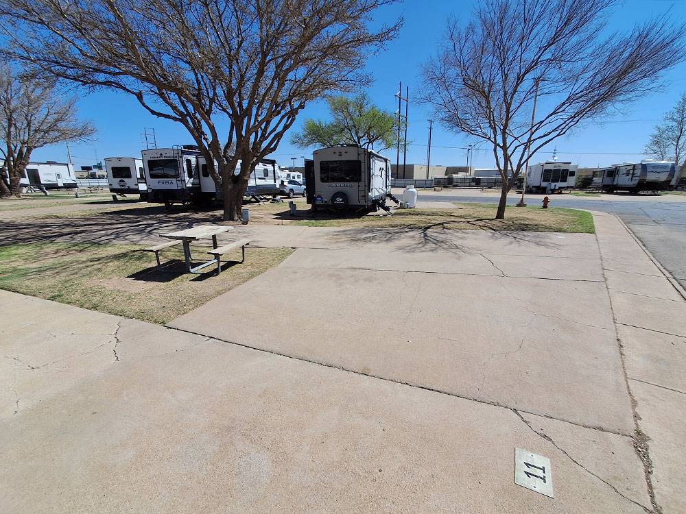 A paved RV site and picnic table