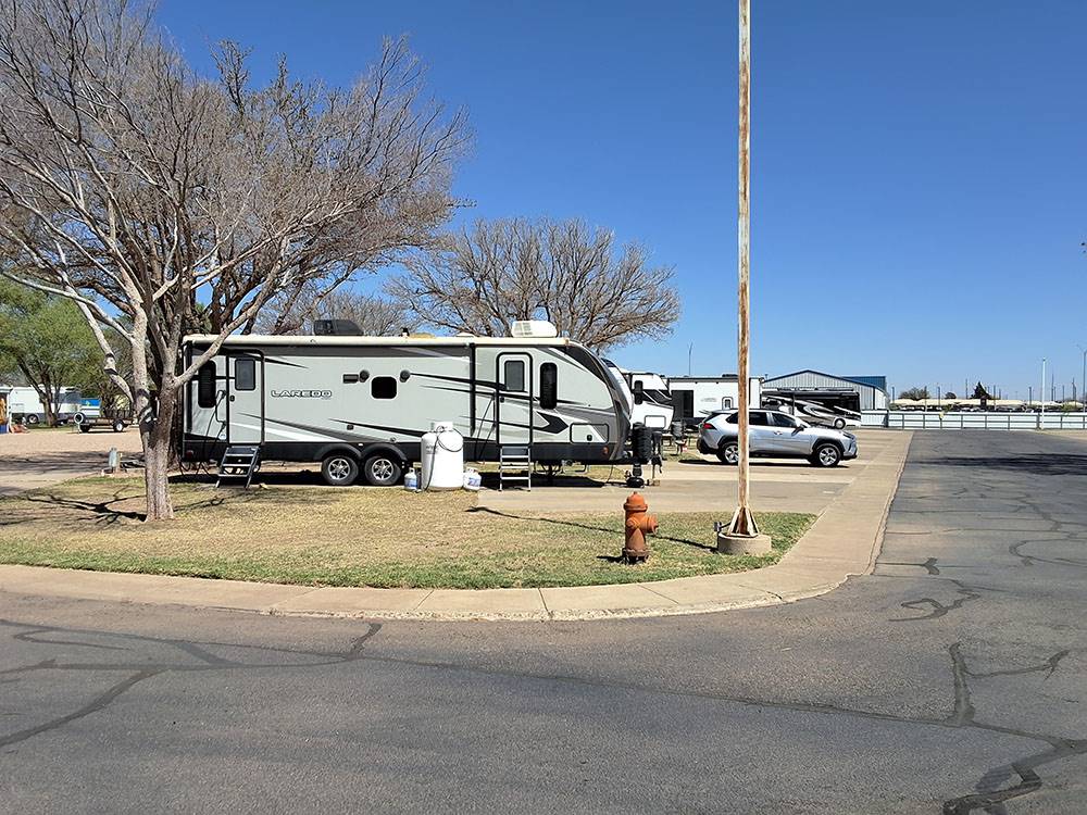 A travel trailer in a corner site