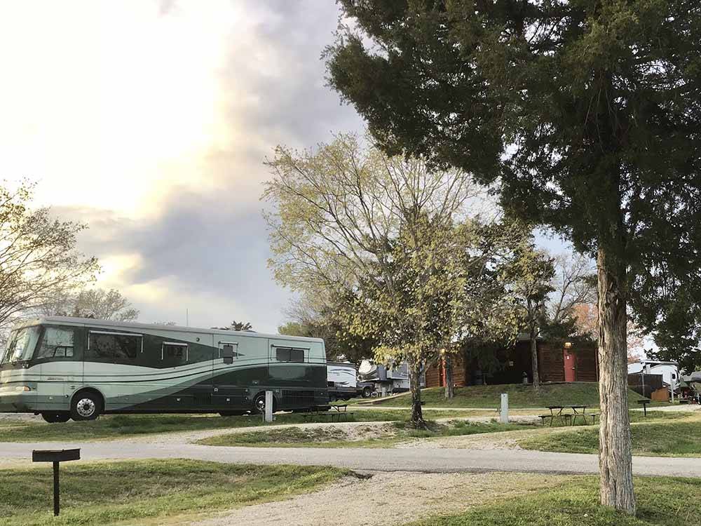 A motorhome backed in a RV site at AMERICA'S BEST CAMPGROUND