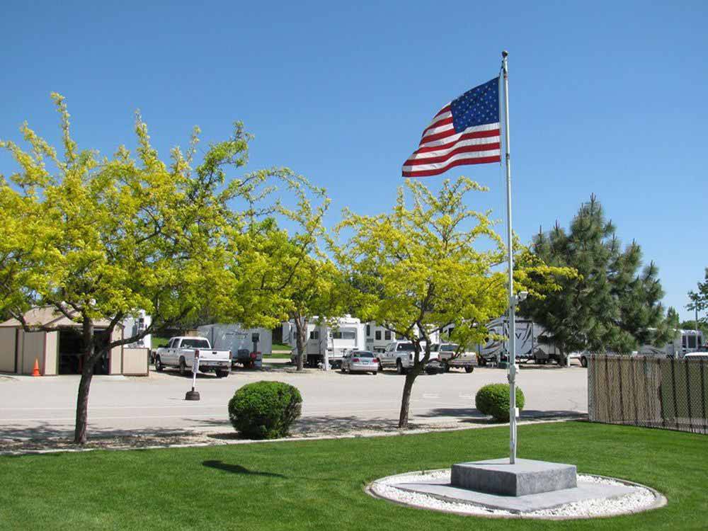 The flag pole next to trees at HI VALLEY RV PARK