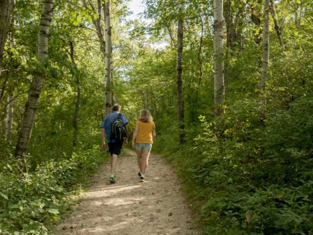 Couple hiking down walking path at LAKE BYLLESBY CAMPGROUND