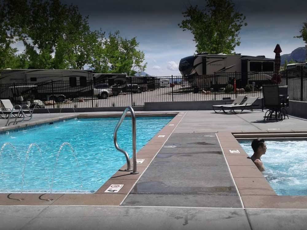 The pool and hot tub area at SPANISH TRAIL RV PARK
