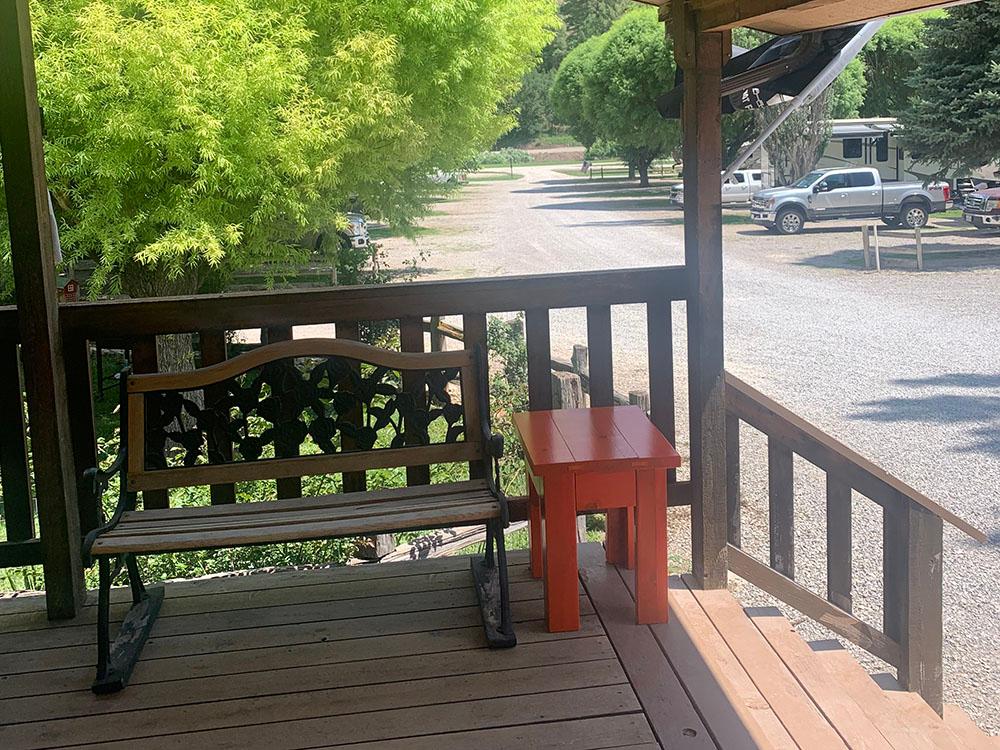 A bench near the steps of the deck at DEER SPRINGS RV RESORT