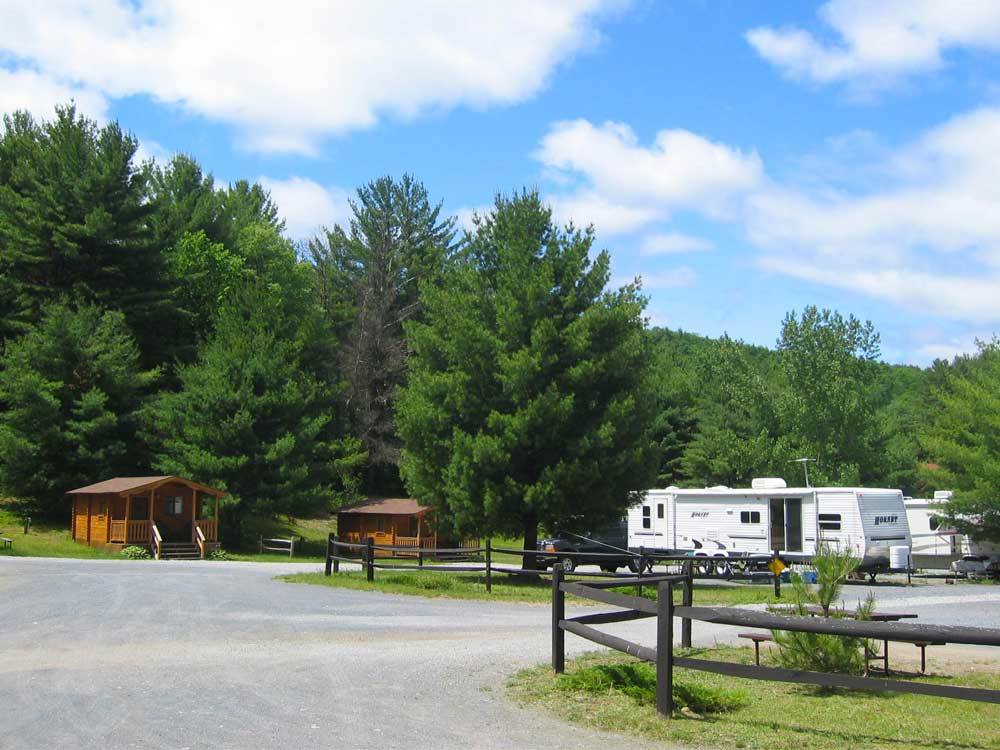 Cabins with deck and trailers camping at LAKE GEORGE SCHROON VALLEY CAMPGROUND
