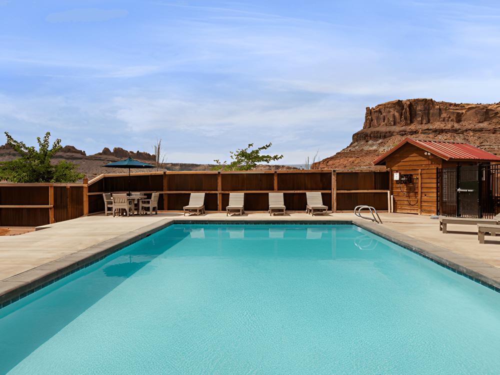 Pool with mountains in the view at Sun Outdoors Canyonlands Gateway