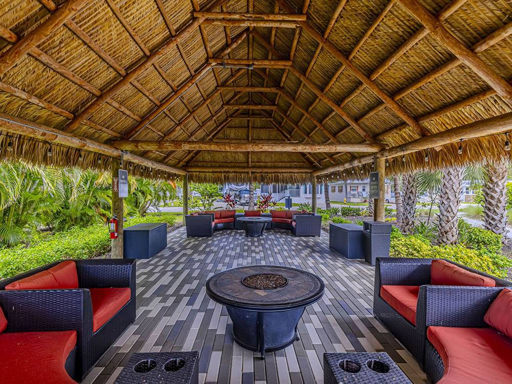 Covered lounge seating around fire pits