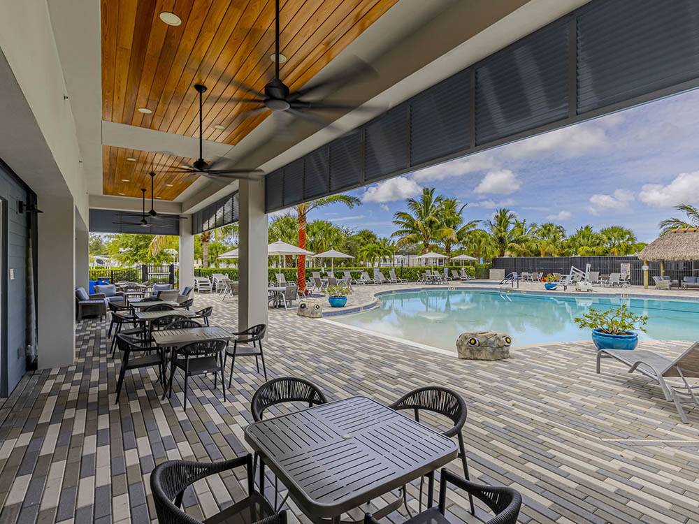 Table and chair seating near the pool