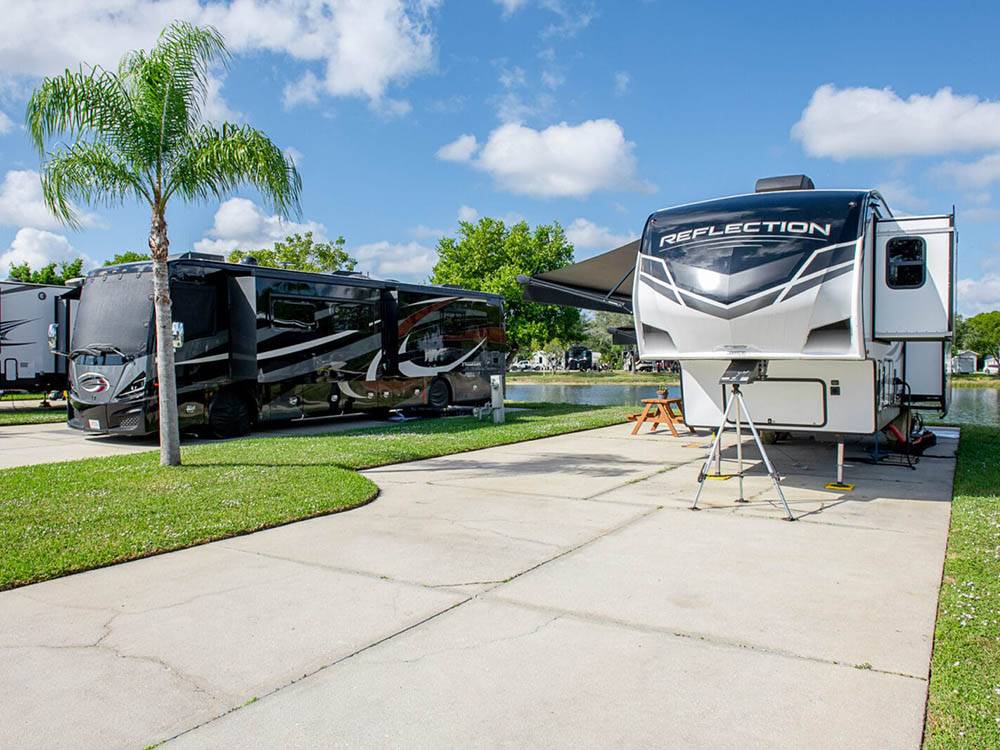 A fifth wheel RV in a paved site