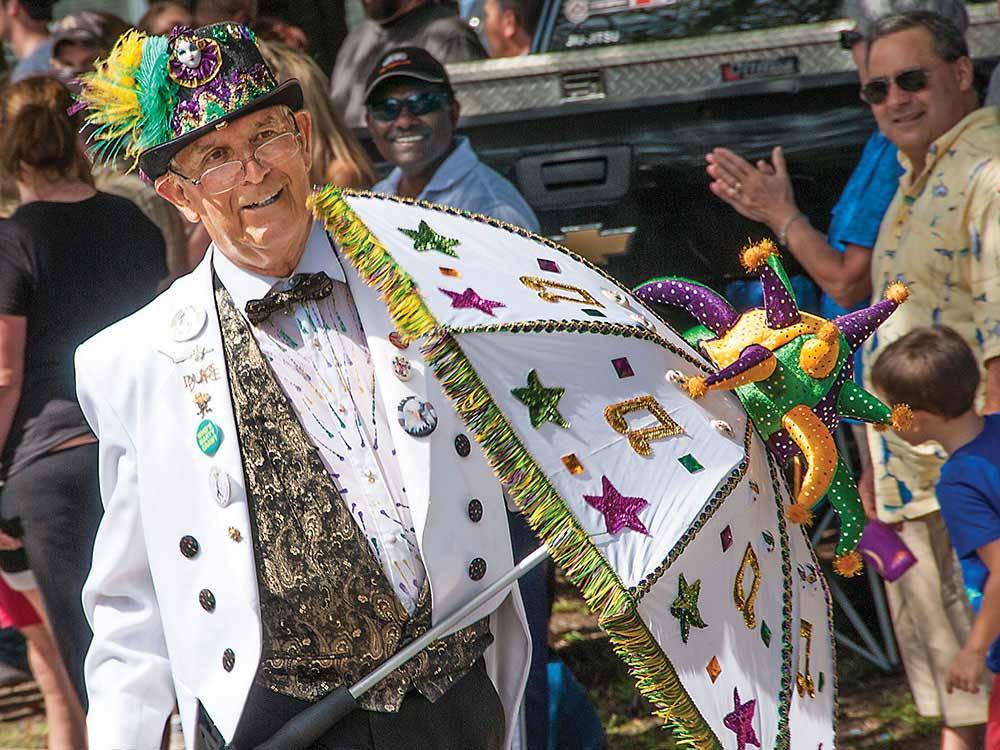 Mardi Gras costumed man at CAJUN COAST VISITORS & CONVENTION BUREAU