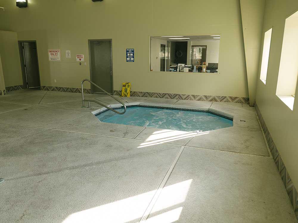 Indoor hot tub available for guests at DRIFTWOOD RV PARK