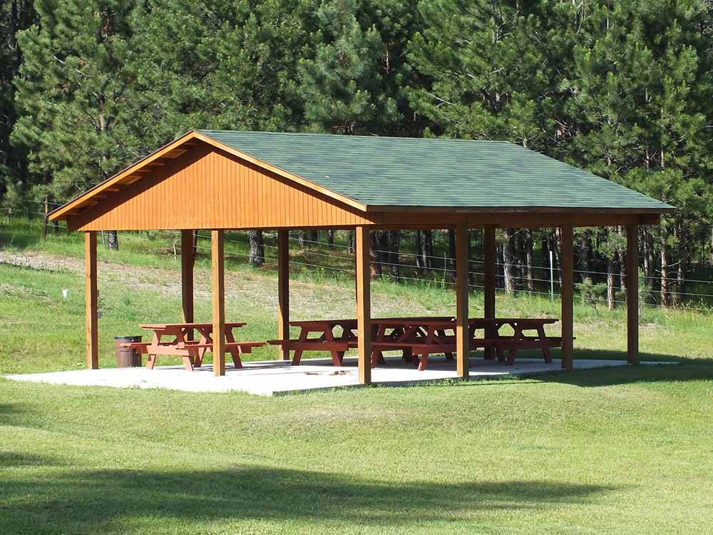 A covered pavilion with picnic tables at FORT WELIKIT FAMILY CAMPGROUND