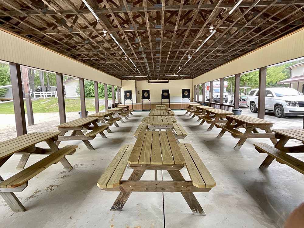 Picnic benches under a pavilion at COLD SPRINGS CAMP RESORT