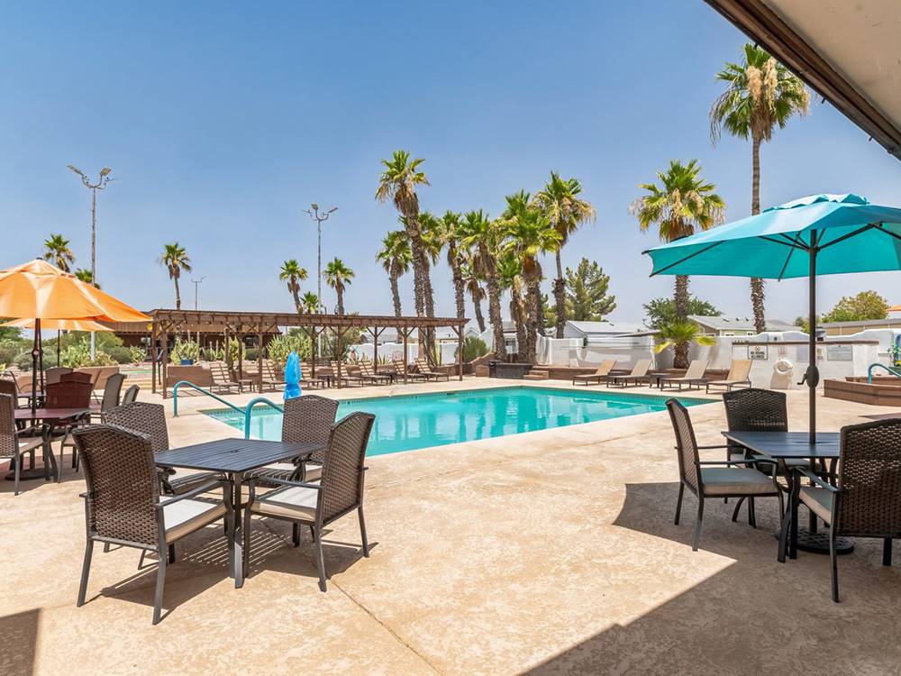 Covered tables by the pool