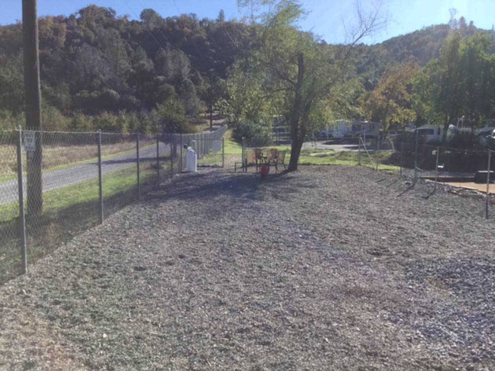 The fenced in pet area at MOUNTAIN GATE RV PARK