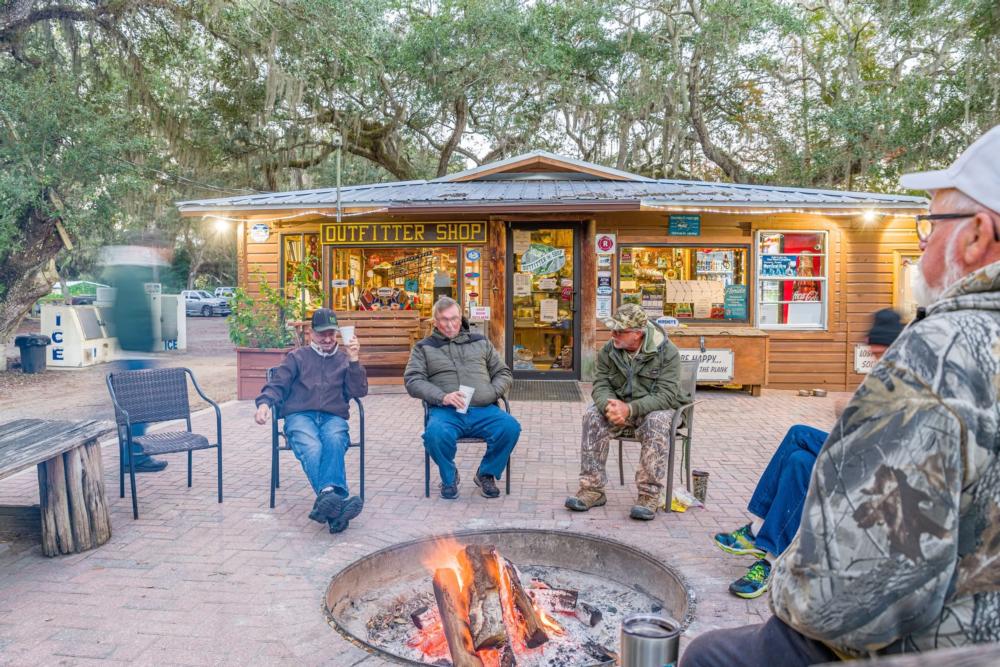 People sitting around a campfire