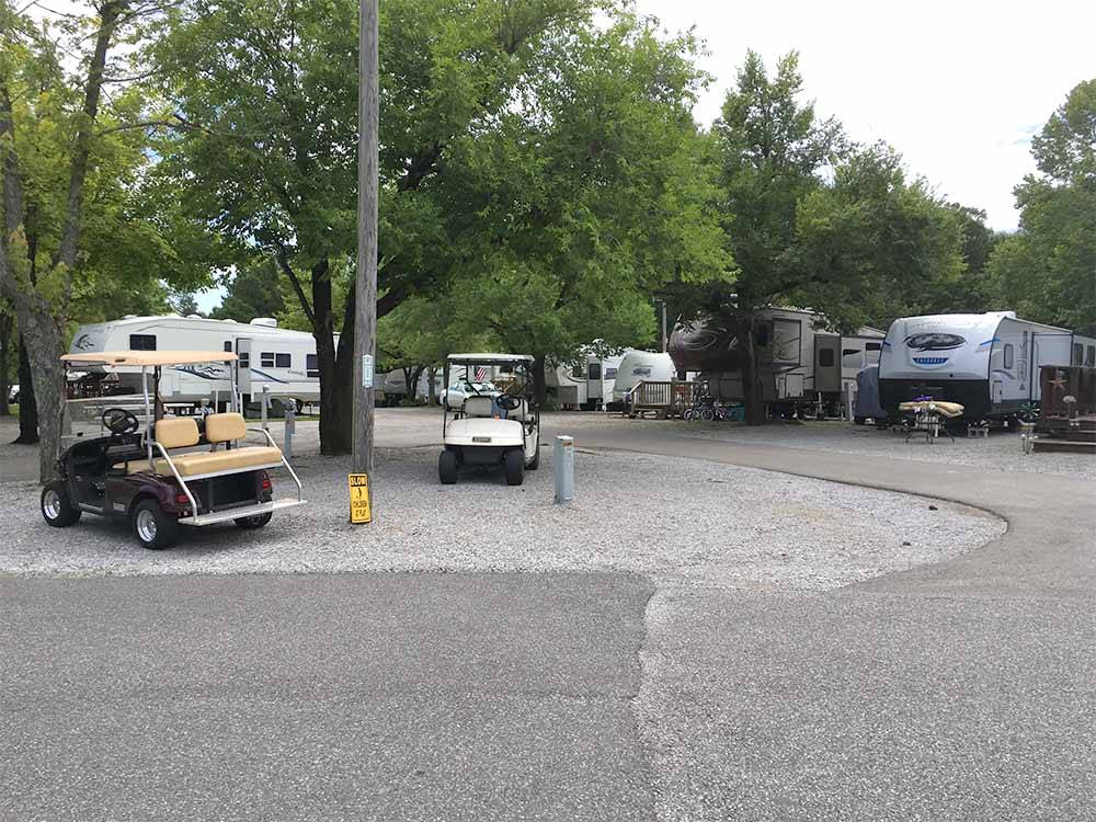 A couple of golf carts at OUTBACK RV RESORT