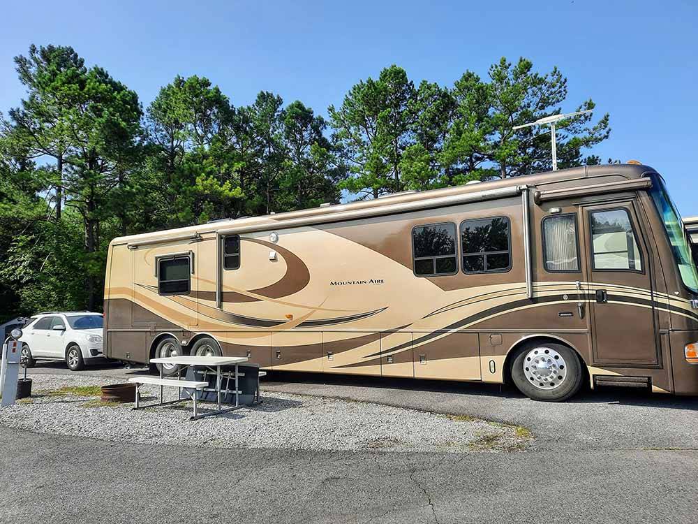 A motorhome in an RV site at OUTBACK RV RESORT