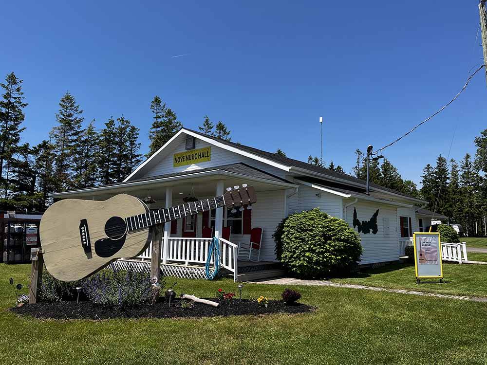 A large guitar in front of the music hall at BORDEN/SUMMERSIDE KOA