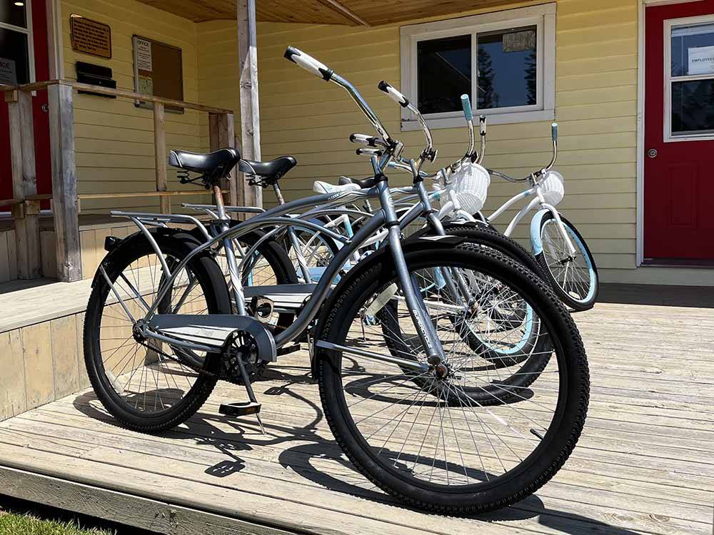Multiple bicycles parked outside a building at BORDEN/SUMMERSIDE KOA