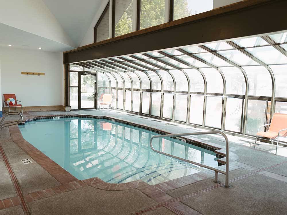 View of indoor pool with window wall at ALDERWOOD RV PARK