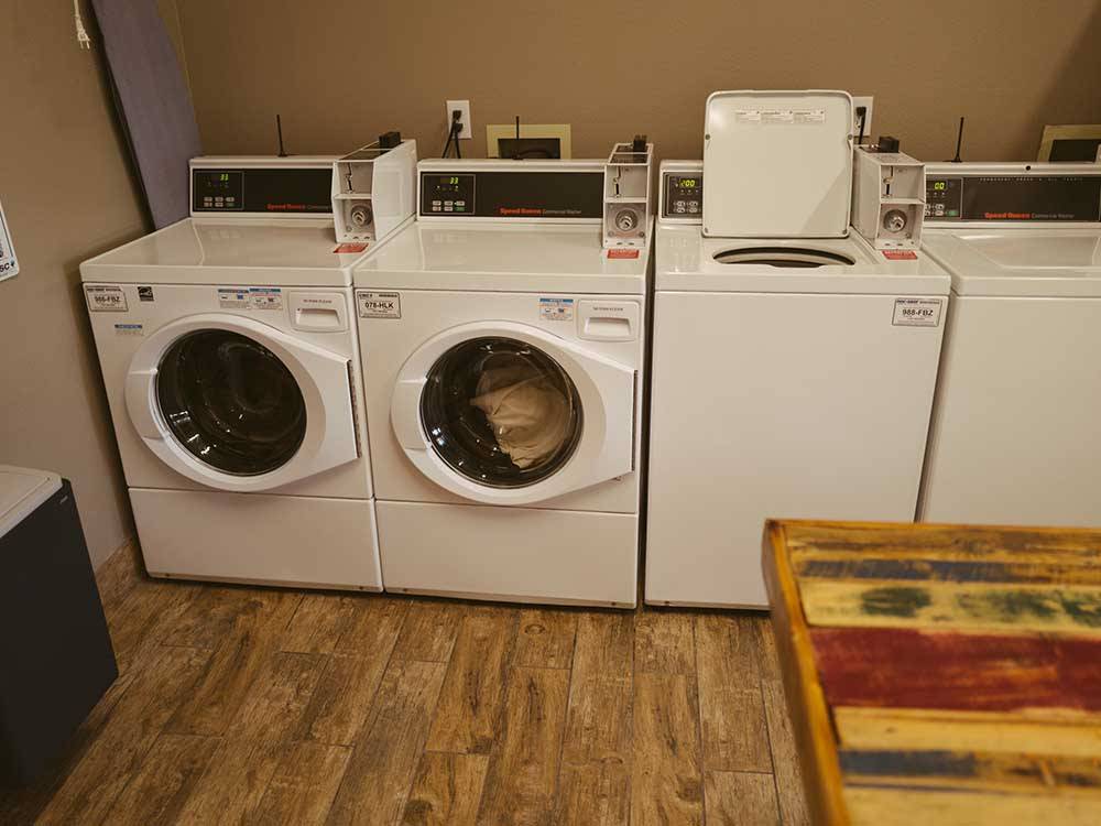 Laundry room with washers and dryers at ALDERWOOD RV PARK