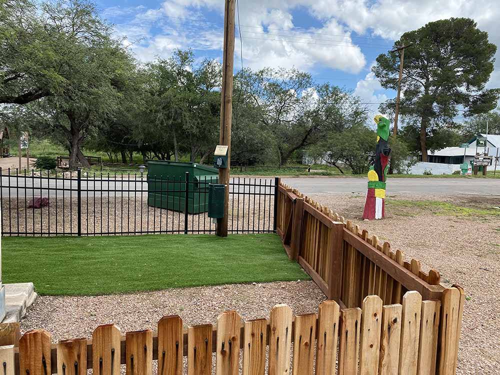 The fenced in dog area at STAMPEDE RV PARK