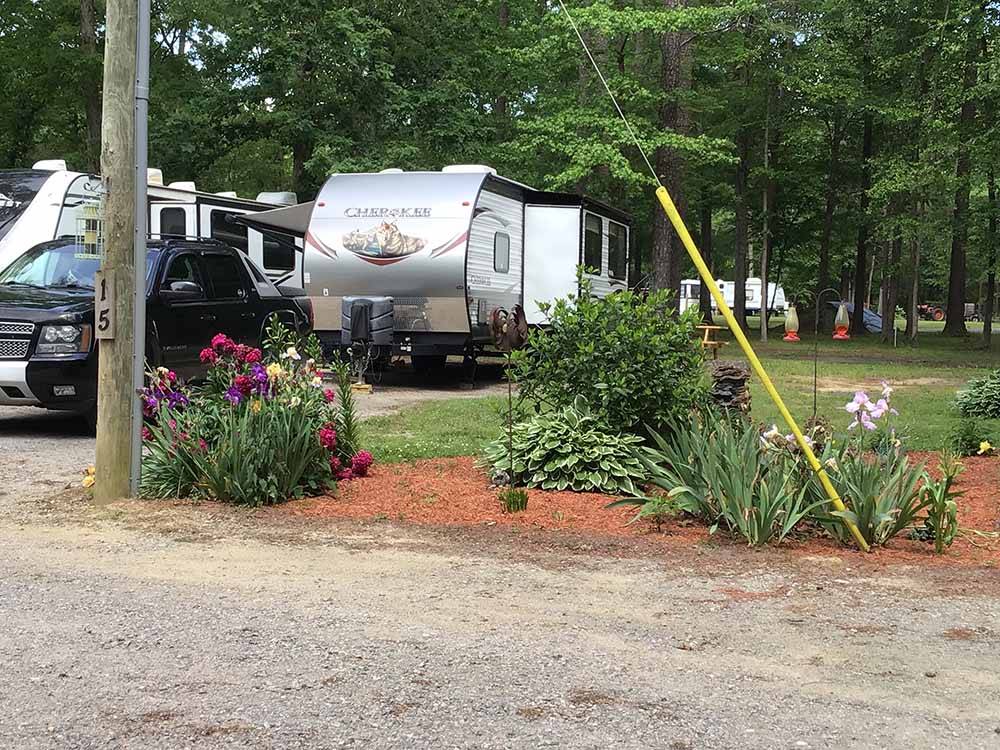A flower planter next to an RV site at CAMPTOWN CAMPGROUND