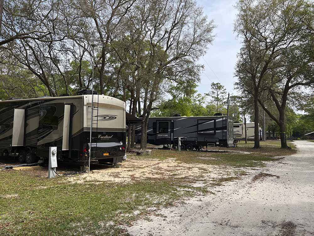 A row of sandy RV sites at RIVERS EDGE RV CAMPGROUND