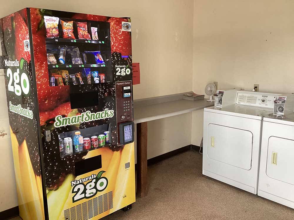 A vending machine and dryers at MOUNTAIN RANGE RV PARK