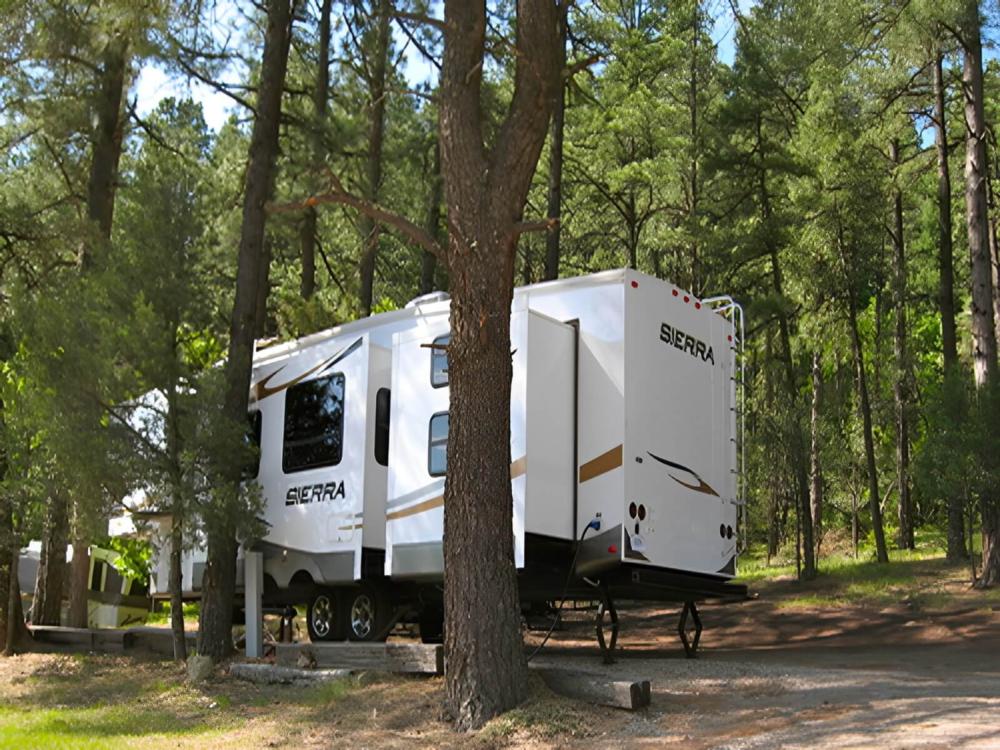 Parked RV at site Bonito Hollow RV Park & Campground