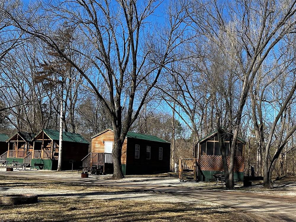 A row of cabins for rent at PIN OAK RV RESORT BY RJOURNEY