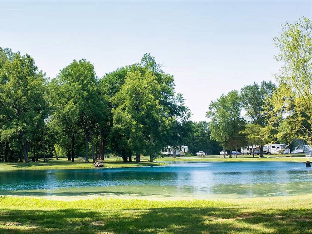 A view of the lake next to the sites at PIN OAK RV RESORT BY RJOURNEY