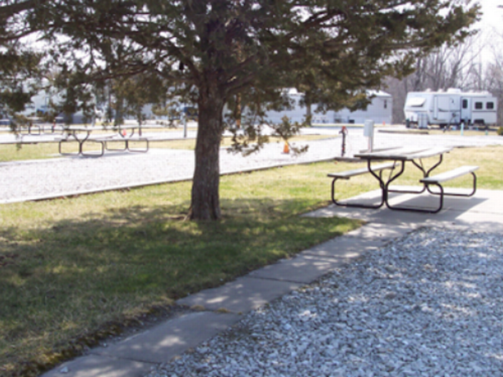 A trailer and van parked in a site