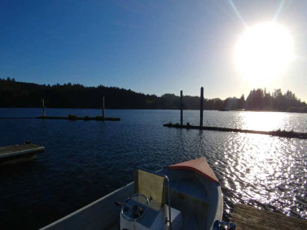 View of the sun setting over the water at OSPREY POINT RV RESORT