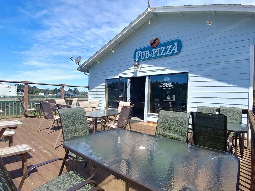 Outdoor deck for dining at local pizza place at OSPREY POINT RV RESORT