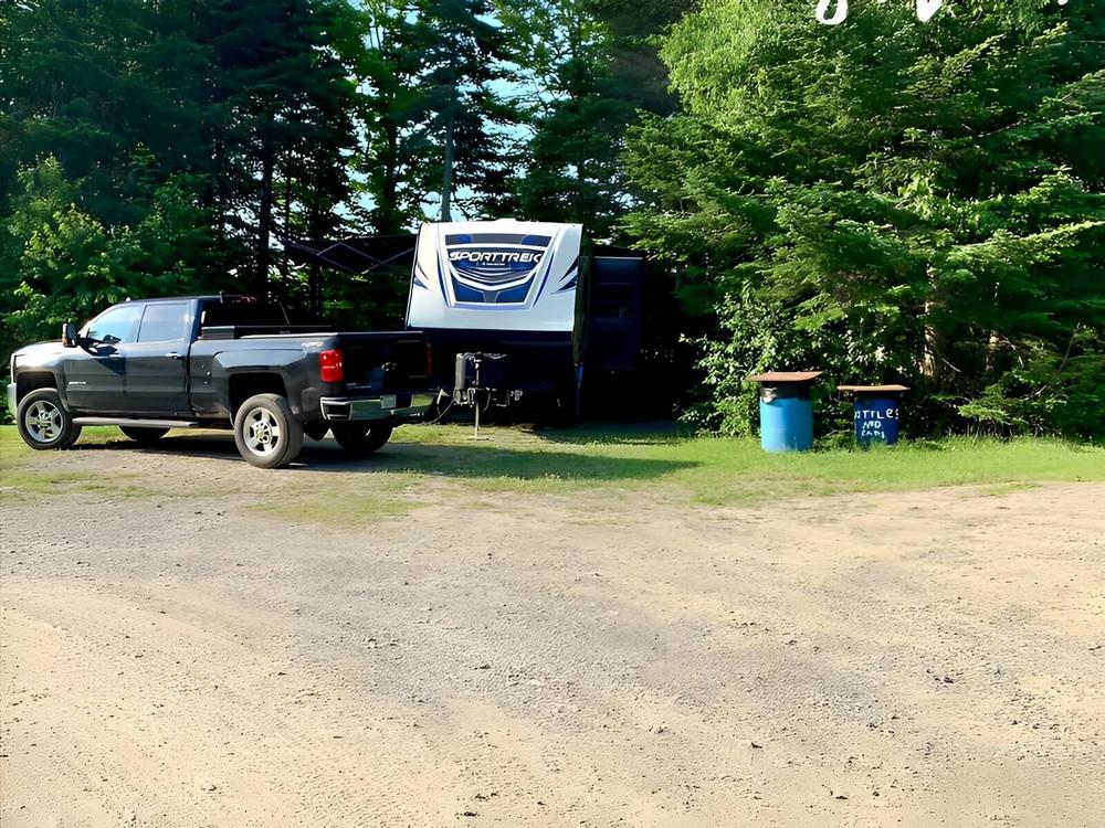 Gravel road by site Moosehead Family Campground