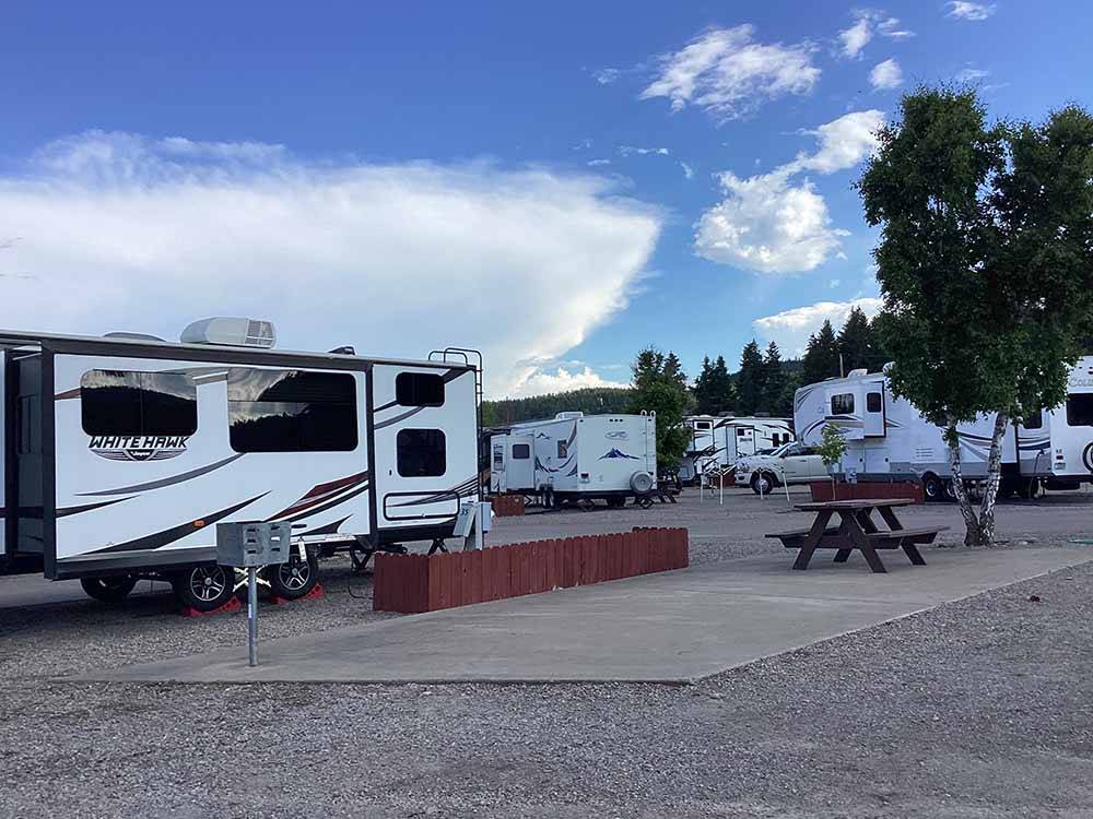 A group of gravel RV sites at FLATHEAD HARBOR RV, LUXURY CONDOS AND CABINS (FORMERLY EDGEWATER RESORT)