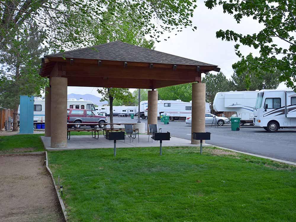 BBQ pits beside covered patio area park at SILVER SAGE RV PARK