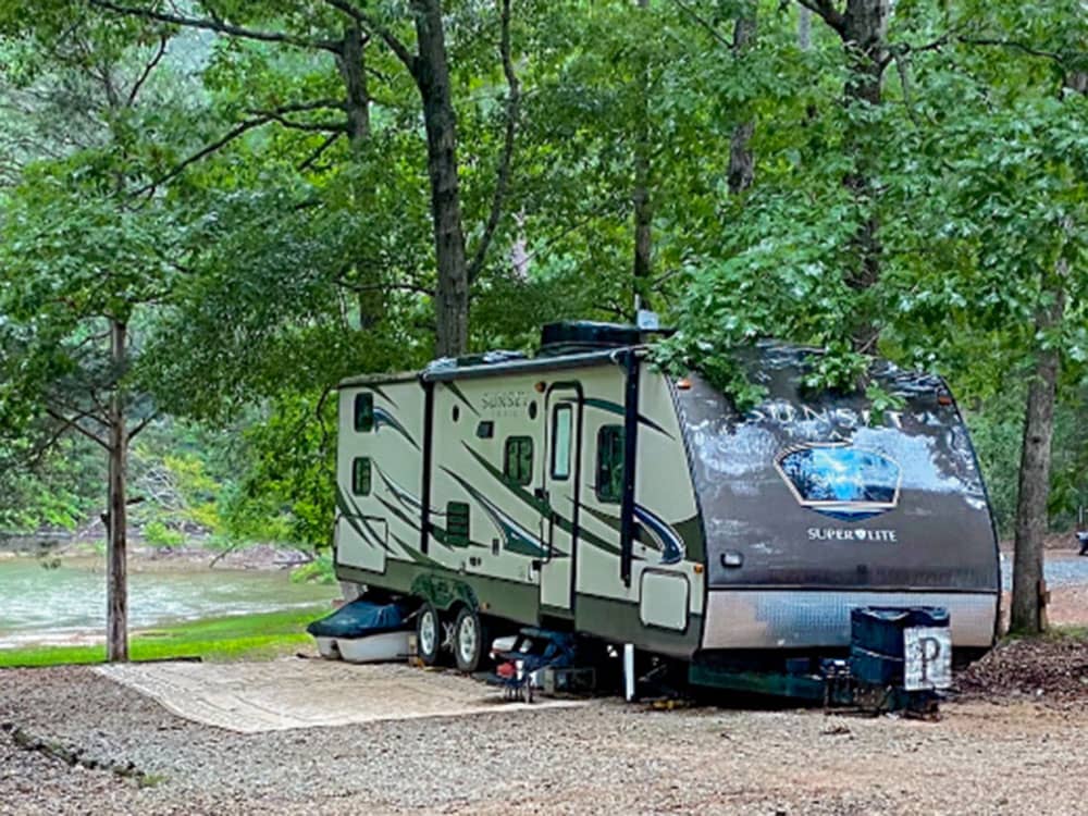 An RV at site with a river view