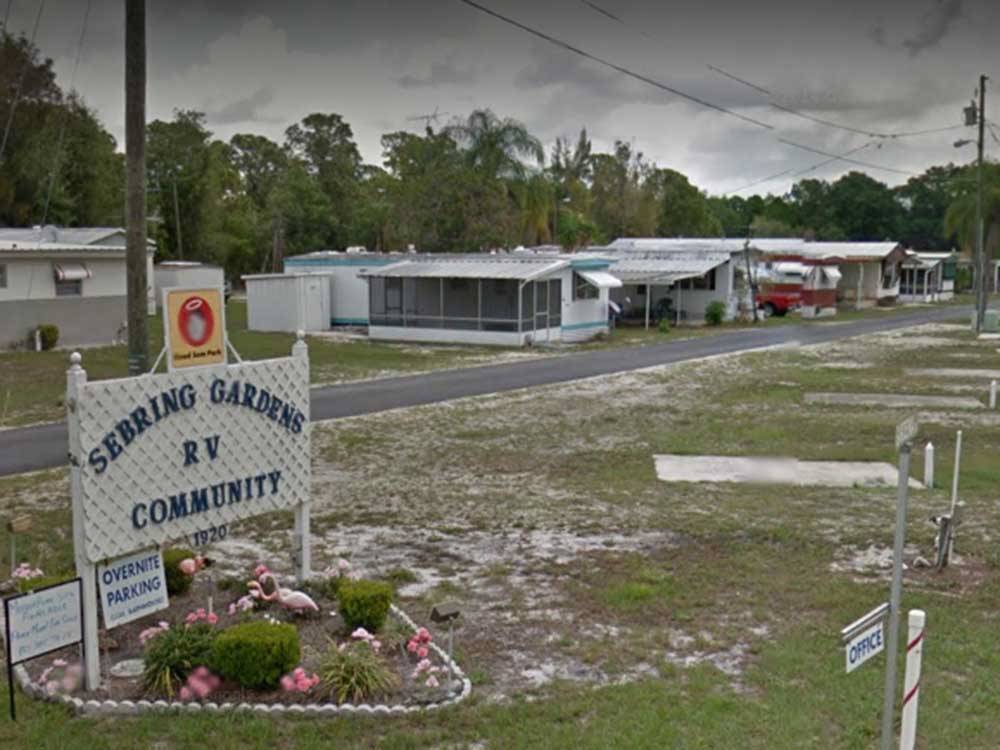 The front entrance sign with a Good Sam sign on top at SEBRING GARDENS RV COMMUNITY