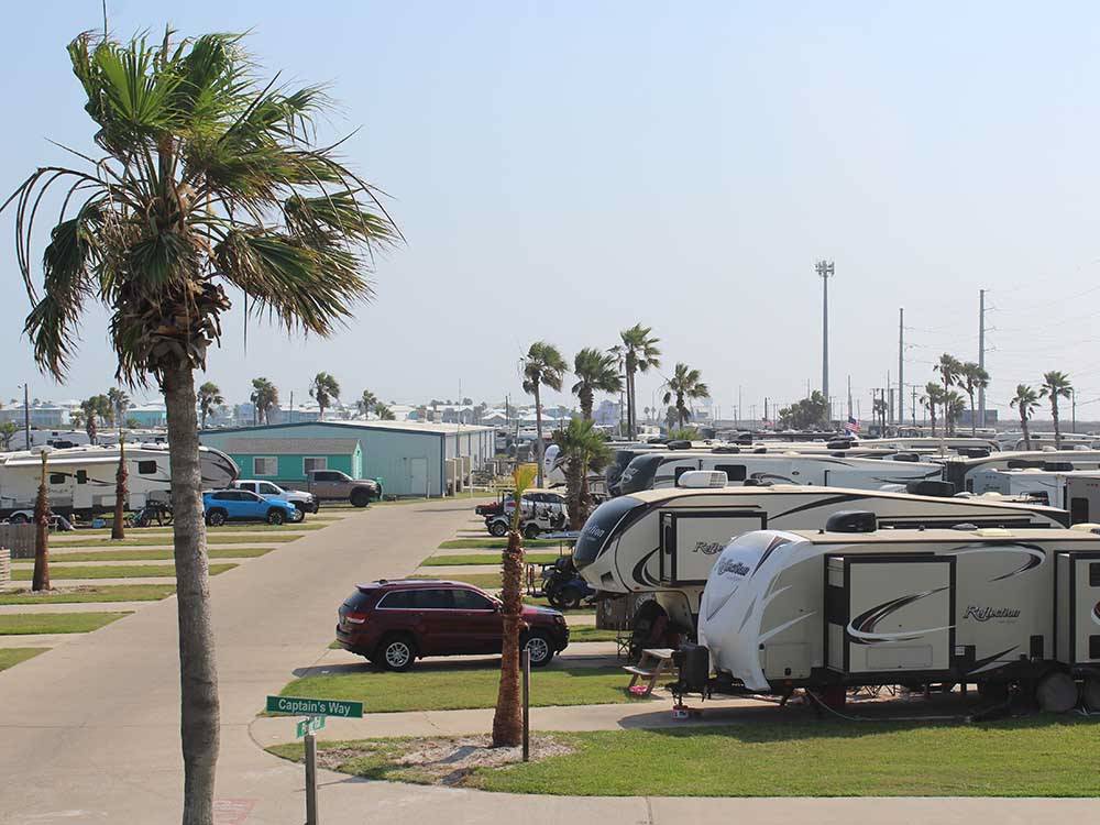 A row of travel trailers in paved sites at PIONEER BEACH RESORT