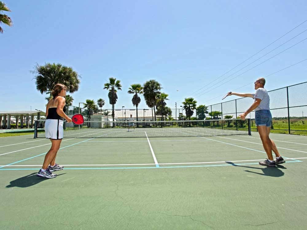 Couples playing pickleball at ENCORE TOBY'S