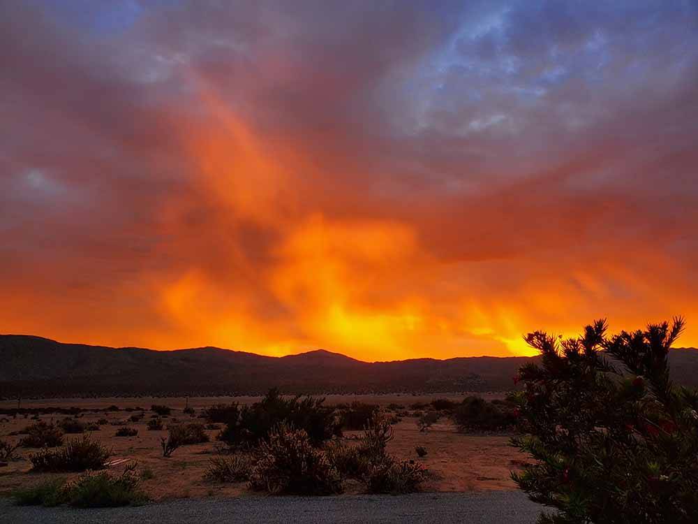 A colorful sky with mountains at STAGECOACH TRAILS RV PARK