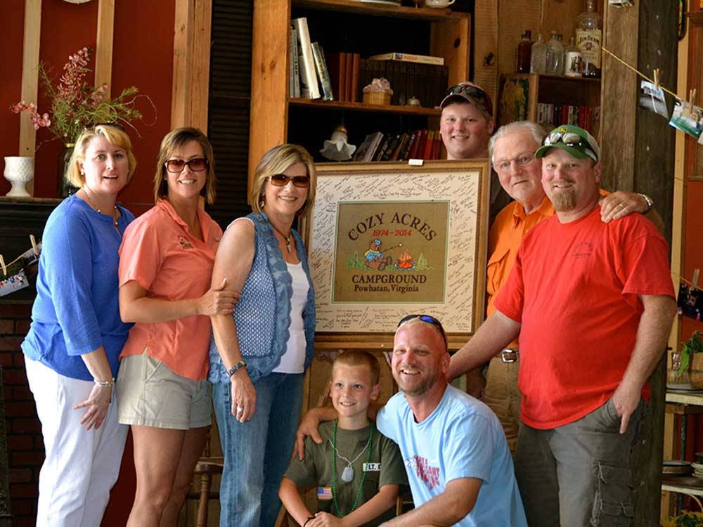 Group photo of people in large lodge at COZY ACRES CAMPGROUND/RV PARK
